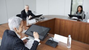 Senior executives discussing strategy in a boardroom