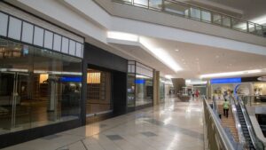 Shopping centre interior with closed retail stores